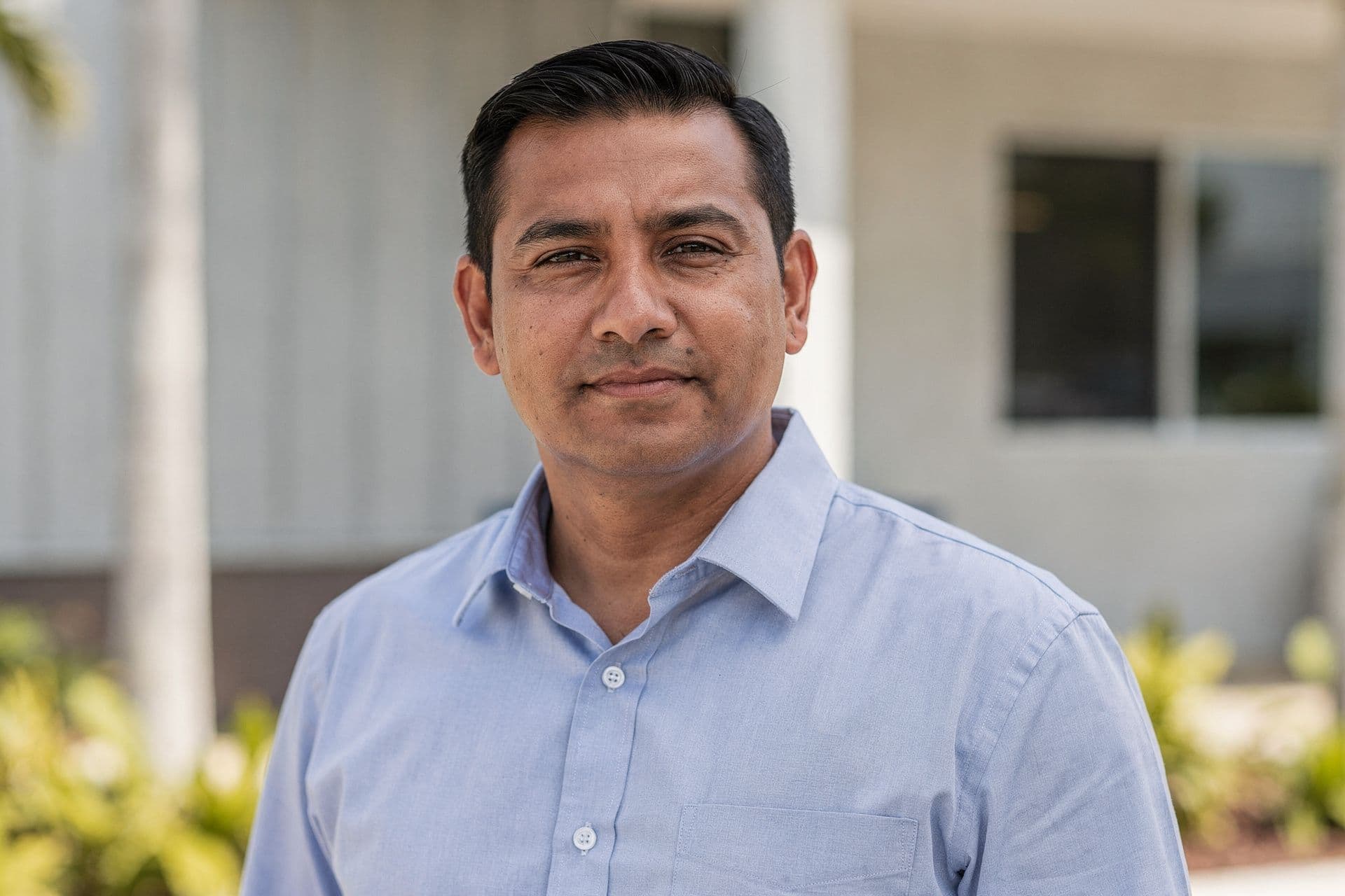 Victor Ramirez, Director of Operations & Co-Founder of Island Breeze Hospitality Group a hospitality business in South Florida standing with a calm, assured presence